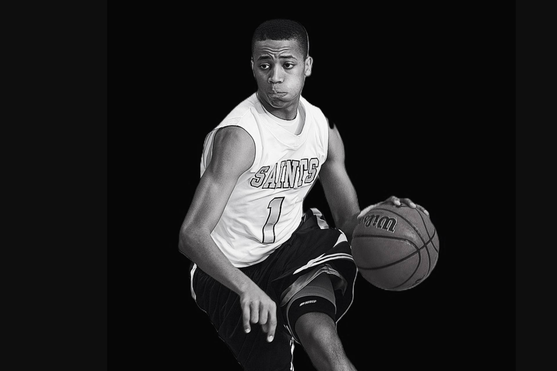 Basketball player mid-dribble